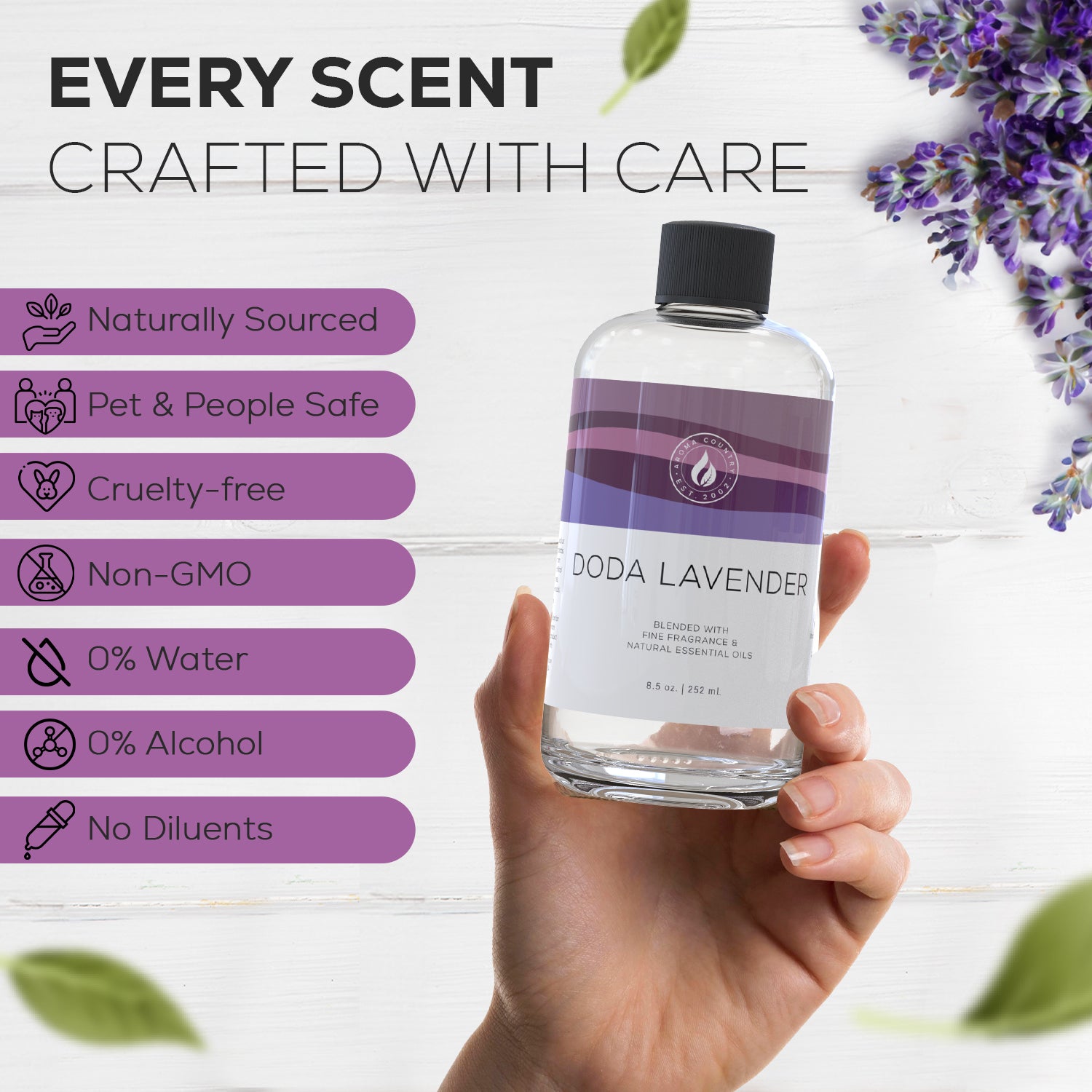 Doda Lavender essential oil held in hand, highlighting its cruelty-free, non-GMO, alcohol-free, and naturally sourced blend crafted for cold air diffusion.