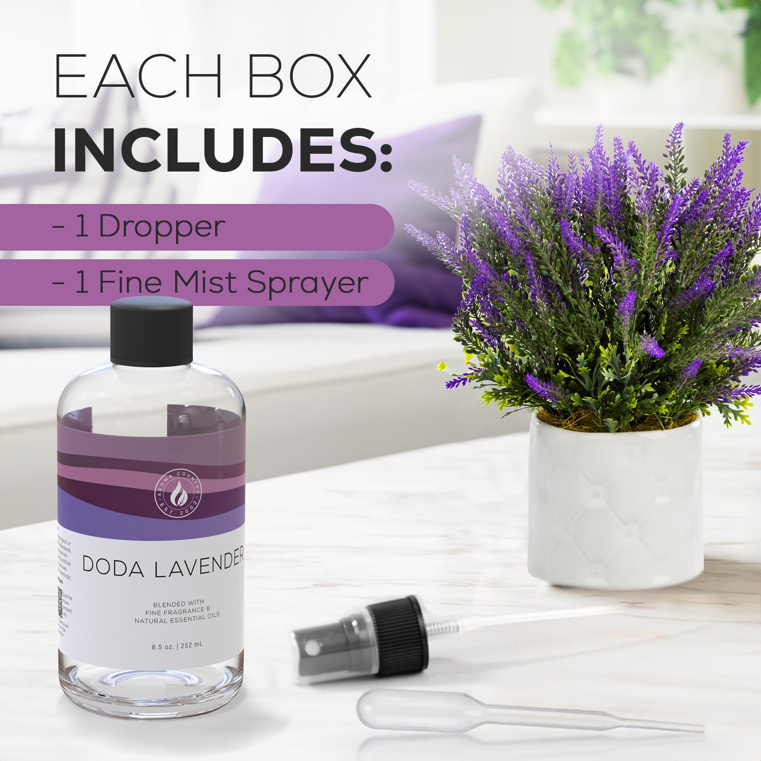 Doda Lavender fragrance oil displayed with dropper and mist sprayer beside a lavender arrangement, ideal for use with a cold air diffuser.