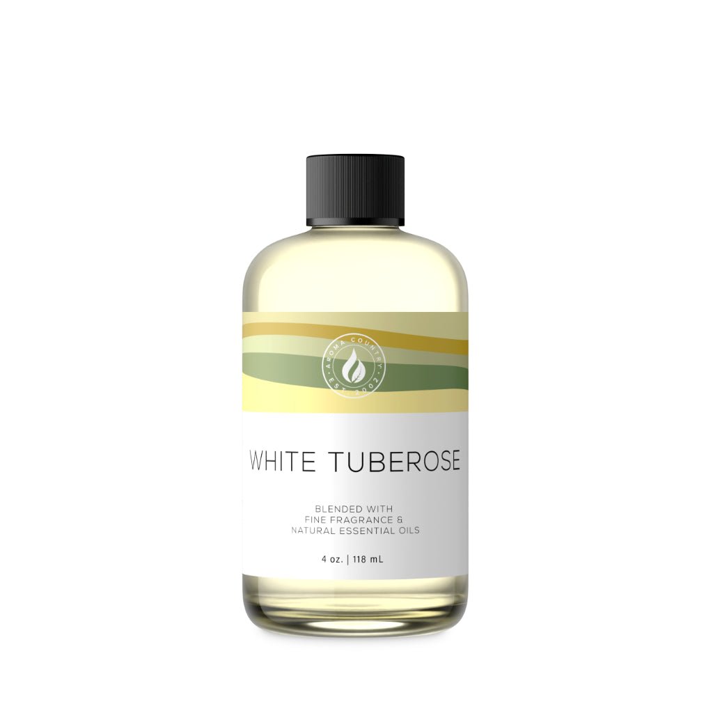 A 4 oz bottle of White Tuberose fragrance oil featuring a creamy floral aroma with soft green undertones and a velvety petal finish for whole-room ambiance