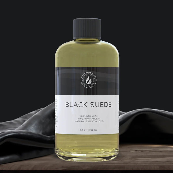 Black Suede diffuser oil in 8.5 oz bottle, offering a bold and refined aroma with masculine warmth and leather-inspired depth.