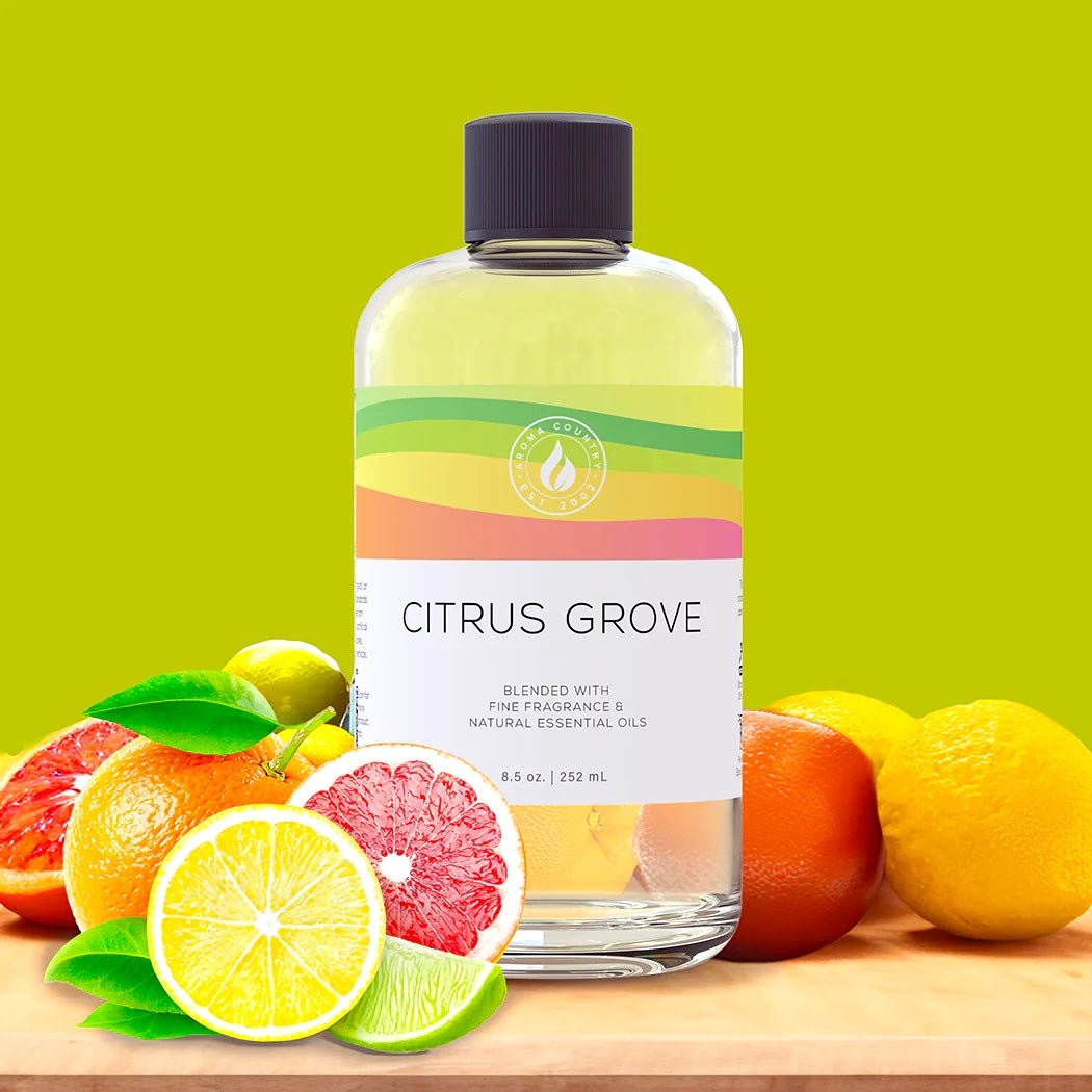 Citrus Grove diffuser oil in 8.5 oz bottle, infused with vibrant notes of lemon, lime, grapefruit, and orange for a fresh, energizing aroma.