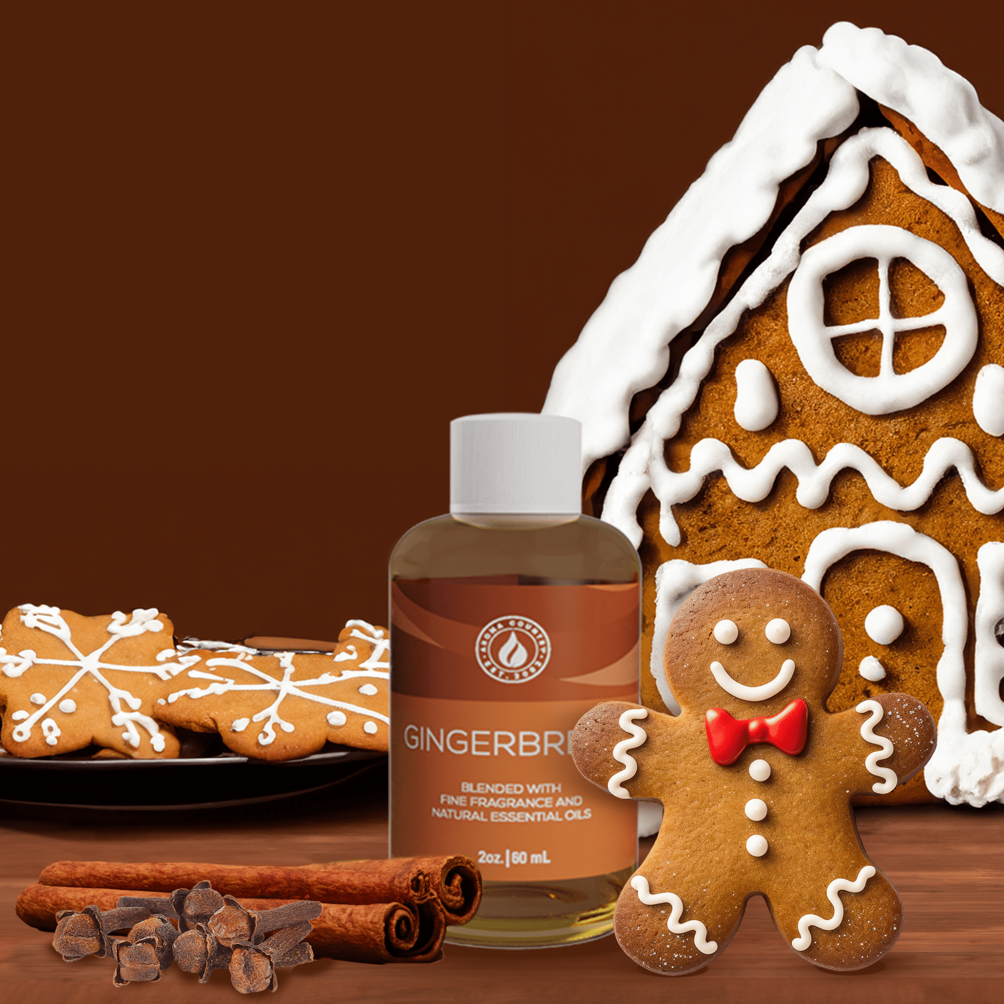 2 oz Gingerbread diffuser oil from Aroma Country styled with cinnamon sticks, chocolate, gingerbread cookies, and a festive holiday backdrop.
